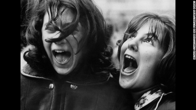 Ecstatic fans await The Beatles outside the Plaza Hotel, where the band was staying in New York during its tour.