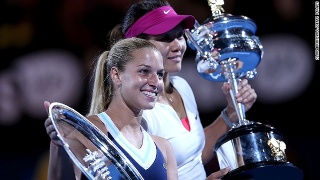 The Slovakian shows off the runners up trophy to photographers at the Rod Laver Arena in Melbourne. 