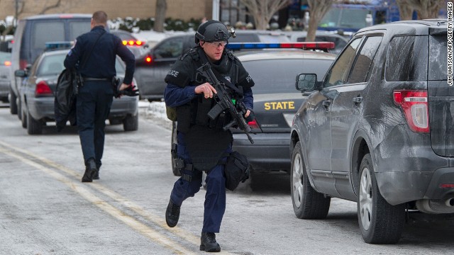 Maryland State Police patrol outside the mall. 