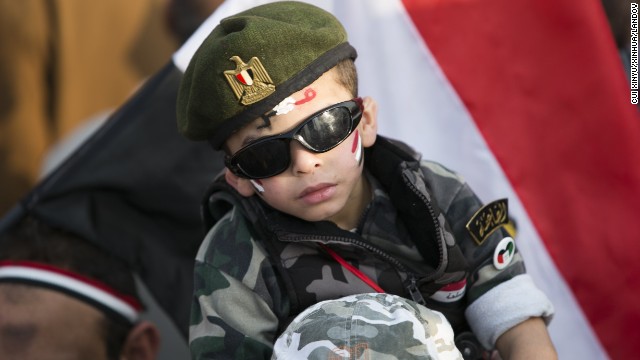 A boy is seen during a rally marking the anniversary.