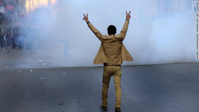 A supporter of the Egyptian military leadership flashes the victory sign during clashes with Muslim Brotherhood supporters.