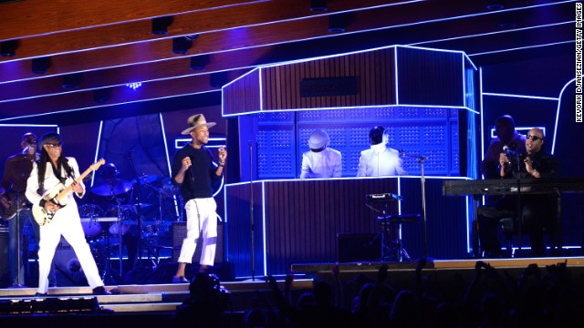 From left, Nile Rodgers, Pharrell Williams, Daft Punk and Stevie Wonder rock the crowd with several hit songs from over the years, including the 2013 single "Get Lucky." "Get Lucky" won record of the year. Daft Punk also won album of the year for "Random Access Memories."