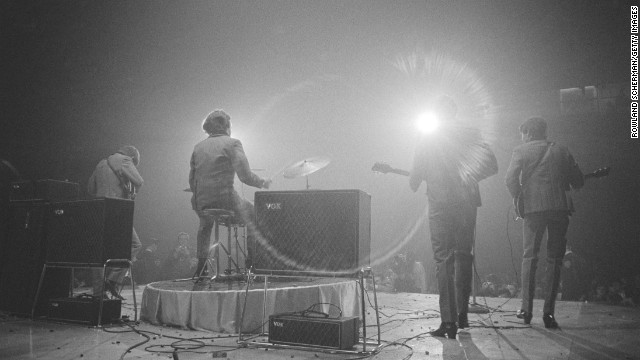 The Beatles perform on stage at the Washington Coliseum on February 11, 1964. It was their first U.S. concert.