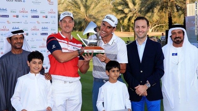 Sweden's Henrik Stenson and Rafa Cabrera-Bello of Spain share the Champions Challenge trophy after both finished six under par in the warm-up to Thursday's main event. 