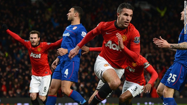 Mata celebrates as Robin van Persie gives Manchester United the lead just six minutes into the Spaniard's debut. 
