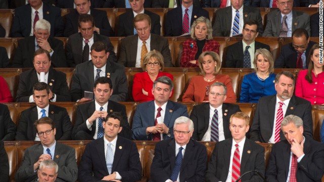 Republican senators and representatives listen to President Barack Obama's speech during the State of the Union.