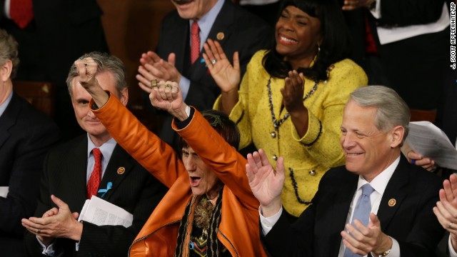 Rep. Rosa DeLauro, D-Connecticut, center, and Rep. Terri Sewell, D-Alabama, cheer during Obama's speech.