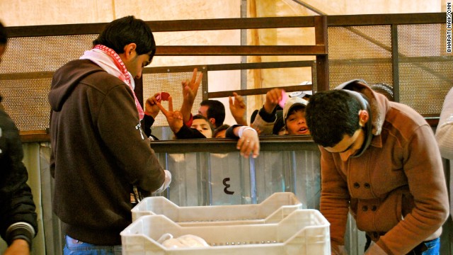 This is the World Food Program's bread distribution center in Zaatari. There are two lines to get bread -- one for men, one for women.