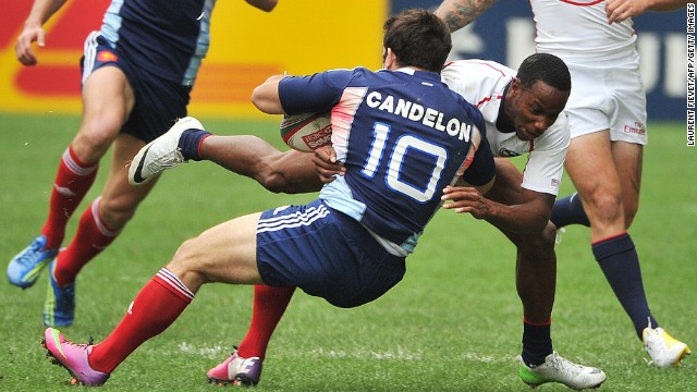 France's Julien Candelon is on the receiving end of a tackle by Isles during last year's Hong Kong Sevens tournament. 