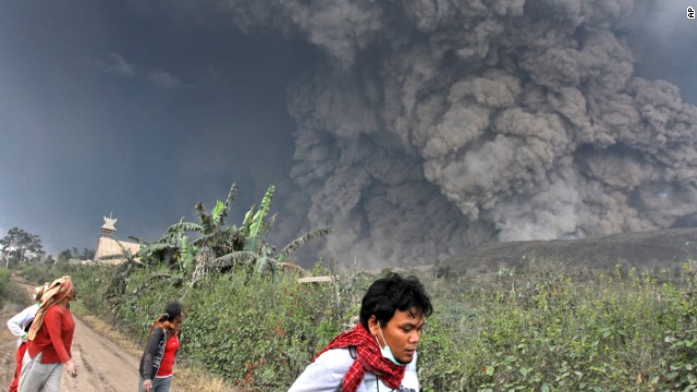 Villagers flee as Mount Sinabung erupts on February 1, in North Sumatra, Indonesia.