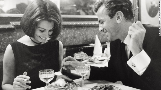 Sophia Loren has dinner with Schell at a restaurant in Hamburg, Germany, during the filming of "The Condemned of Altona" in 1962.