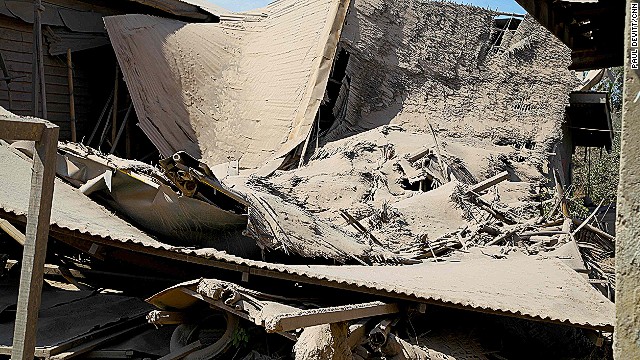 These village houses aren't strong enough to hold the weight of the ash that's built up on roofs. Fortunately no one was injured when this house collapsed under the pressure. 