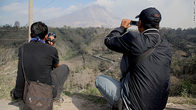 The volcano draws in local media and photographers all hoping to get the best shot or the chance at being there at the right time for the big one.