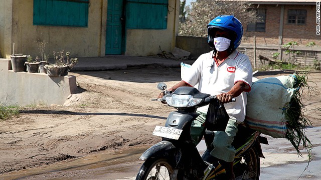 Daily life continues even as Mt. Sinabung continues to erupt. People tell us they aren't afraid -- it's been happening for months and they need to continue to work to provide for their families.