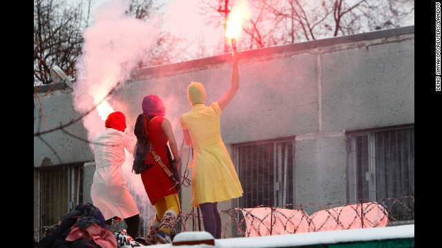 Pussy Riot members stage a performance near a detention center in Moscow to support detained opposition activists Ilya Yashin and Alexei Navalny in December 2011. 