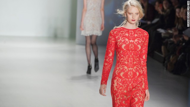 Japanese-born designer Tadashi Shoji sent lace and embroidered gowns down the runway like this red, long-sleeved number on February 6, 2014.
