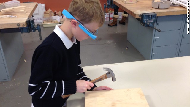 A young student uses Google Glass to record his work in art class at the Episcopal Academy in Newtown Square, Pennsylvania. Margaret Powers, who coordinates technology for the private school's youngest students, was selected for Google's Glass Explorer program, which allows people to test the wearable computer.