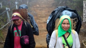 Porters earn 128 Malaysian Ringgit (US$40) for two days\' work on Mount Kinabalu. 