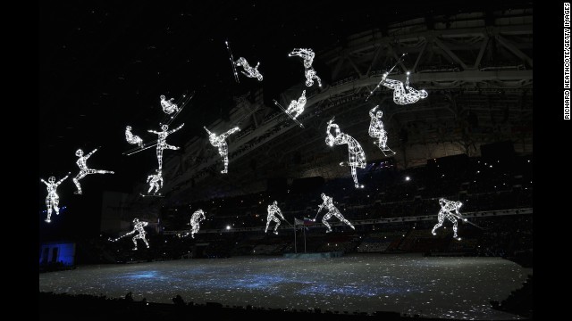 Olympic sports are depicted with lights during the opening ceremony.