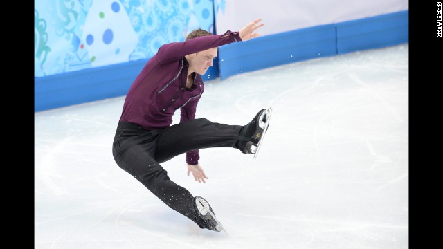 Jeremy Abbott of the United States falls as he performs in the team figure skating event.