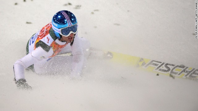 Slovenia's Robert Kranjec lies in the snow after falling in the men's normal hill ski jumping event Saturday, February 8.