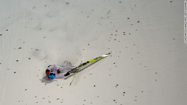 Slovenia's Robert Kranjec falls while competing in the men's normal hill ski jumping event.