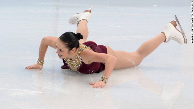 Canada's Kaetlyn Osmond falls as she performs in the women's free skate portion of the team figure skating event.