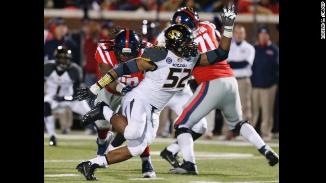 Sam pushes past a block by Mississippi offensive lineman Pierce Burton in the second half of a game on November 23, 2013, in Oxford, Mississippi. 