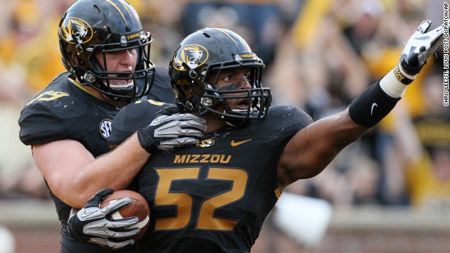 Sam is congratulated by teammate Matt Hoch after returning a fumble for a touchdown against Southeastern Louisiana on September 1 in Columbia, Missouri. 