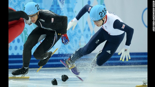 Great Britain's Jack Whelbourne, right, falls as he competes in the 1,500-meter short track final on February 10.