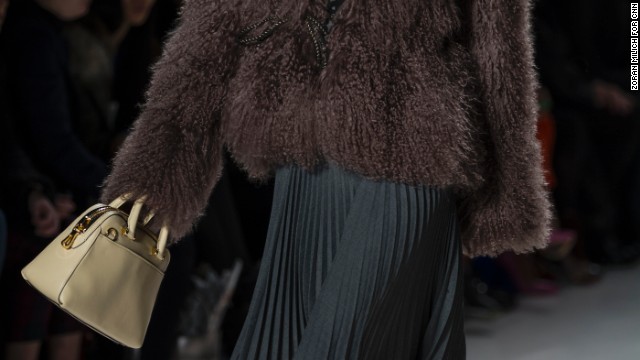 Michelle Smith paired a fur sweater with a flowing, pleated skirt for one of her looks.
