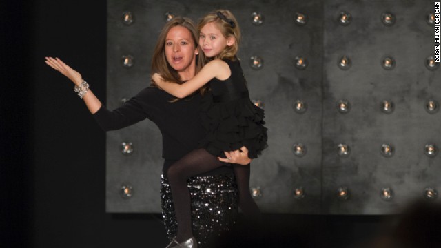 Designer Michelle Smith and her daughter came out to applause at the end of her fashion show on February 10.
