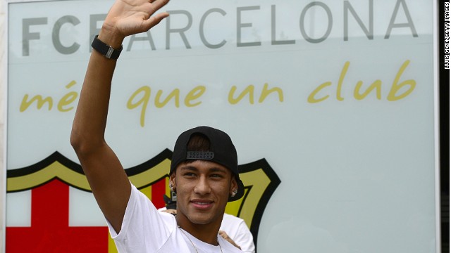 Neymar waves to the crowds after signing a five-deal with Barcelona, but the full nature of the transfer is now under investigation. 