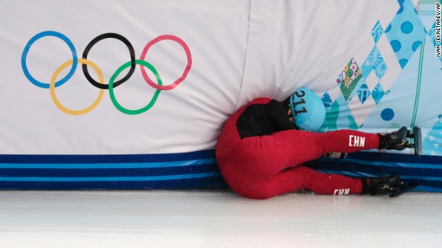 Speedskater Shi Jingnan of China crashes in a men's 1,500-meter short track race on February 10.