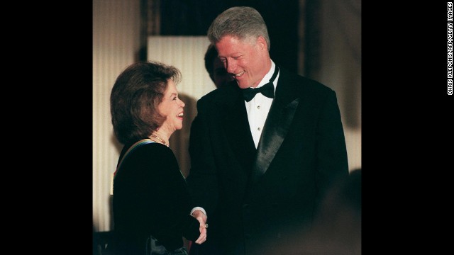 President Bill Clinton greets Temple Black during a reception prior to the 1998 Kennedy Center Honors.