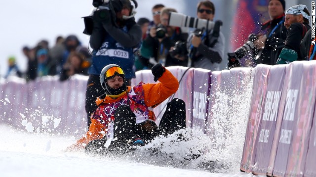 Snowboarder Dolf van der Wal of the Netherlands falls as he competes in the halfpipe on February 11.
