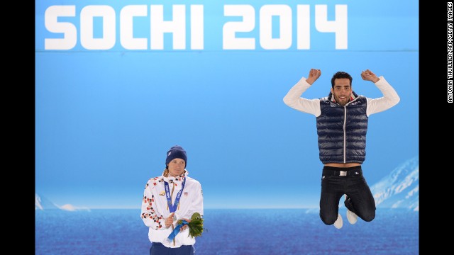 A picture taken with a robotic camera shows French biathlete Martin Fourcade, right, celebrating his gold medal in the 12.5-kilometer pursuit. To his right is silver medalist Ondrej Moravec of the Czech Republic.