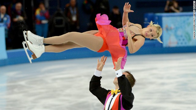Canada's Kirsten Moore-Towers flies in the air after being thrown by Dylan Moscovitch in pairs figure skating February 11.