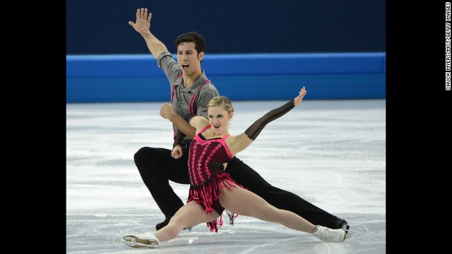 Canadian figure skaters Paige Lawrence and Rudi Swiegers continue their routine.