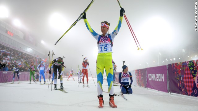 Biathlete Teja Gregorin of Slovenia celebrates after finishing the women's 10-kilometer pursuit on February 11.