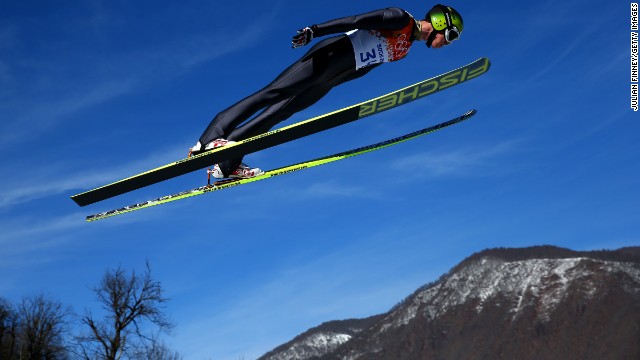 Tim Hug of Switzerland completes a trial jump during the normal hill Nordic combined event on February 12.