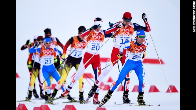 Alessandro Pittin of Italy leads a group of skiers during the cross-country portion of the men's Nordic combined event February 12.