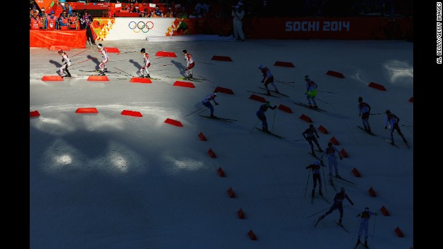Athletes ski during the cross-country portion of the men's Nordic combined on February 12.