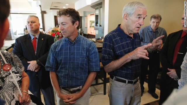 2012 Republican presidential candidate, Rep. Ron Paul, R-Texas, and Rand Paul, his son, speak with supporters before the start of a campaign event in Ames, Iowa, in August 2011.