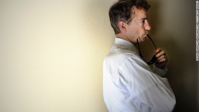 Speaking to miners and coal company owners, Rand Paul waits to tour a mine in May 2010 in Pineville, Kentucky. Paul, son of longtime Texas Rep. Ron Paul, rode the tea party wave that swept the country in 2010 to capture a seat in the Senate. Click through the images to see Paul's political life.