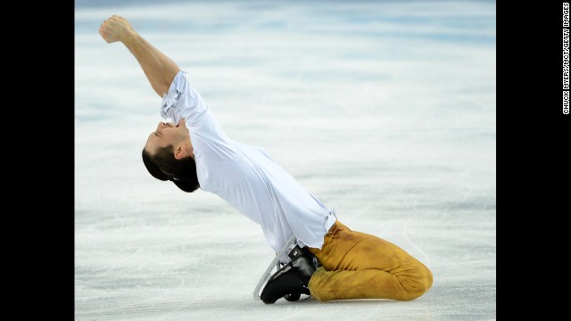 Maxim Trankov of Russia celebrates a gold-medal performance in pairs figure skating.