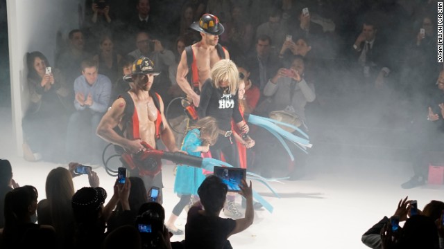 Betsey Johnson, who is 71 years old, showed her "Betsey's Hot" collection on February 12. Fittingly, she came out with firefighters (and her granddaughters!) at the end of the show.