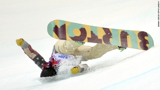 Kelly Clark of the United States falls during her first run in the women's halfpipe finals February 12.