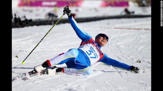 Aino-Kaisa Saarinen of Finland reacts after crossing the finish line during the women's 10-kilometer classic.