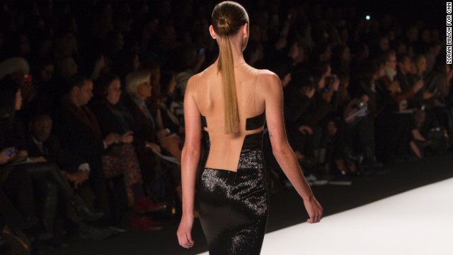 A model walked graced the runway in a little black dress with an edgy open back.